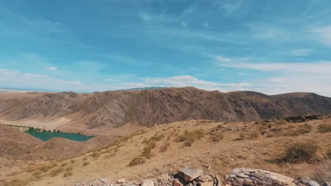 Clouds over mountains and mountain lake Stock Footage 245603431