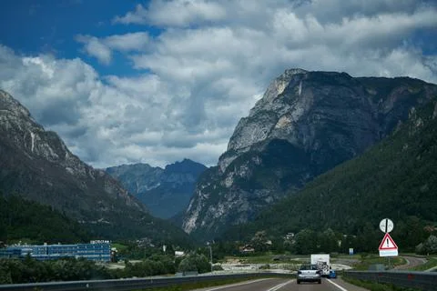 Clouds over the mountains and small birds in a dark sky Fotos Stock