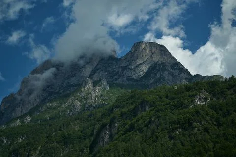 Clouds over the mountains and small birds in a dark sky Fotos Stock