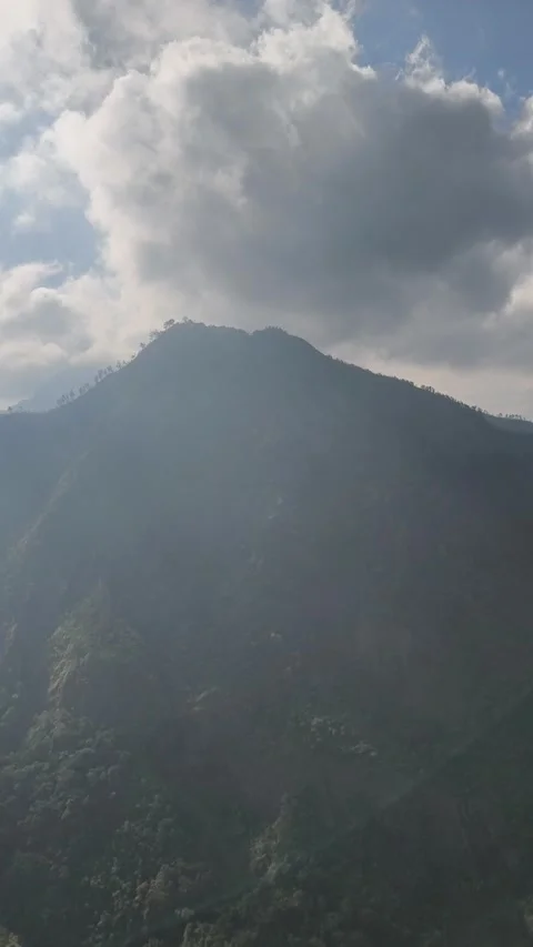 Clouds over the mountains Stock Footage 339386016