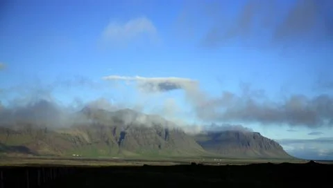Clouds over the mountains Stock Photos