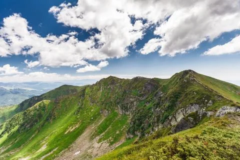 Clouds over the mountains Stock Photos