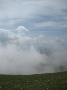 Clouds over the mountains Stock Photos