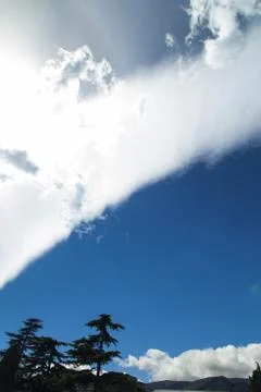 Clouds over mountains Stock Photos