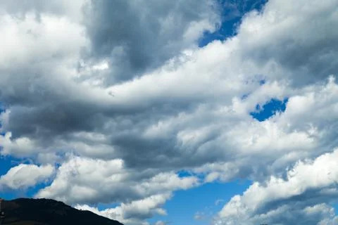 Clouds over mountains Stock Photos