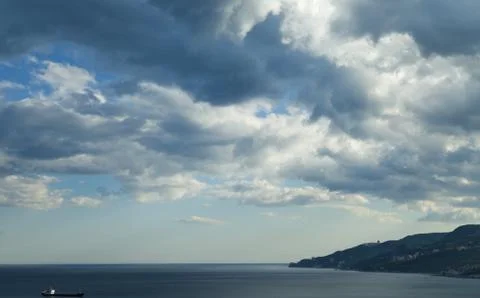 Clouds over mountains Stock Photos