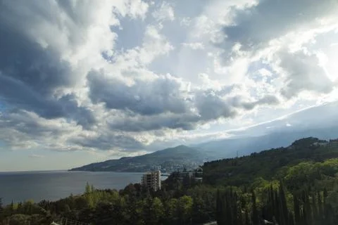 Clouds over mountains Stock Photos
