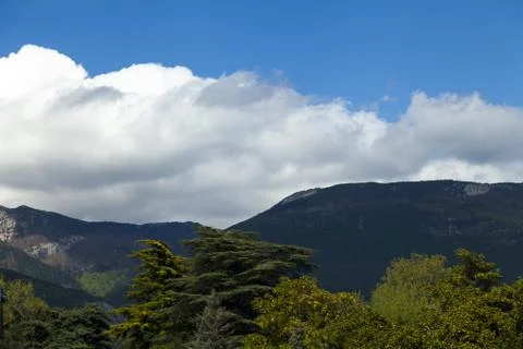 Clouds over mountains Stock Photos