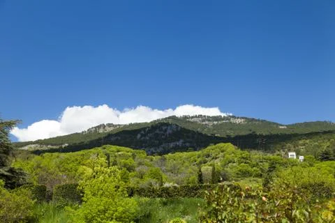 Clouds over mountains Stock Photos