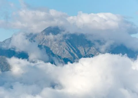 Clouds over mountains Stock Photos