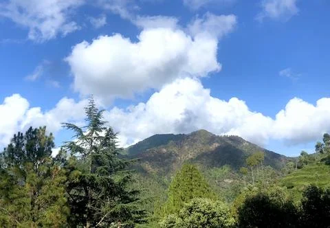 Clouds over mountains Stock Photos