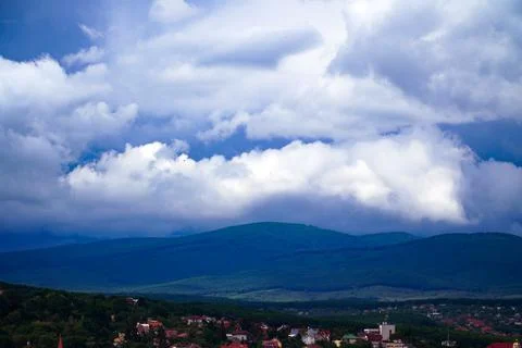 Clouds over the mountains Stock Photos
