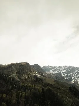 Clouds over the mountains Stock Photos