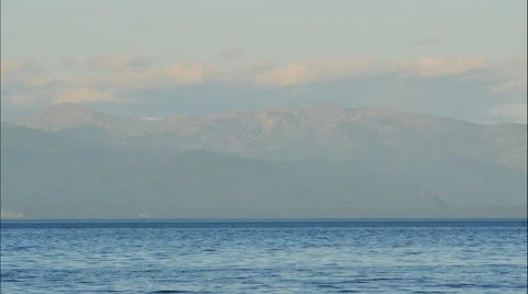Clouds over the mountains on a Sunny day on lake Baikal Stock Footage 65262309