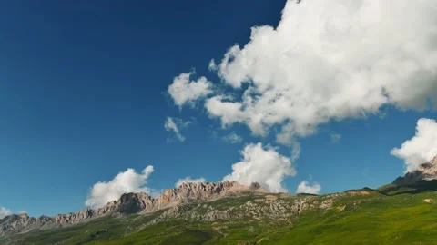 Clouds over the mountains at sunrise timelapse. Video stock 234067830