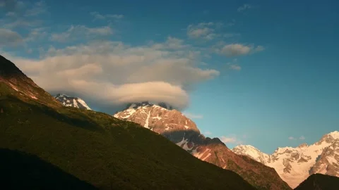 Clouds over the mountains at sunrise timelapse. Video stock 234067852