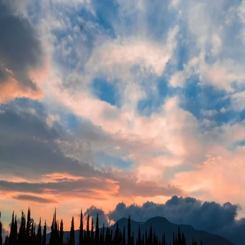 Clouds over mountains at sunset, time lapse Video stock 69489623