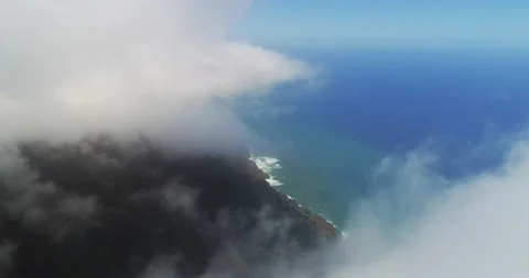 Clouds over Napali Coast in 4k cinematic aerial drone view of dramatic mountains Stock Footage 131196704