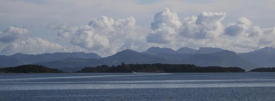 Clouds over the ocean and mountain ranges near Stavanger, Norway. Stock Photos