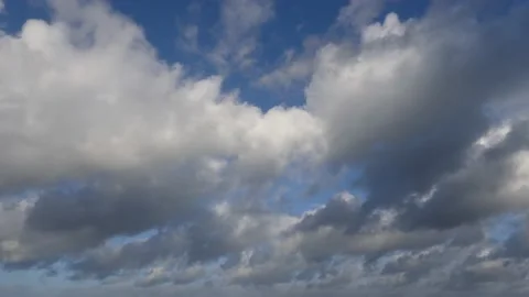 Clouds over the ocean with blue sky - cloudscape background - time lapse Stock Footage 143764431