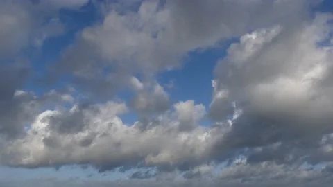 Clouds over the ocean with blue sky - cloudscape background - time lapse Stock Footage 143764472