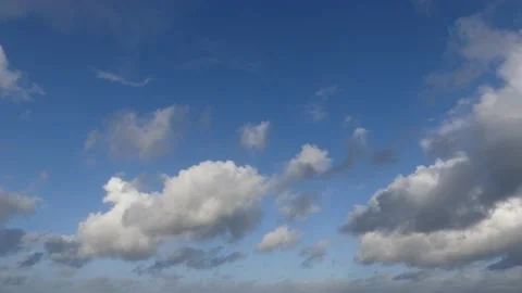 Clouds over the ocean with blue sky - cloudscape background - time lapse Stock Footage 143764975