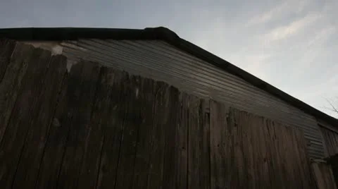 Clouds over old shed Stock Footage 22211101