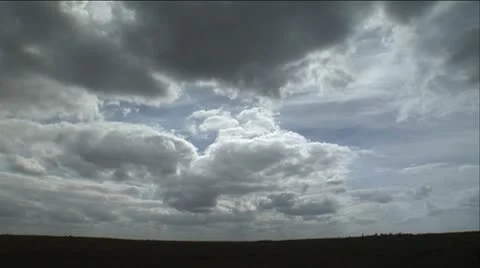 Clouds over open field Stock Footage 12761440