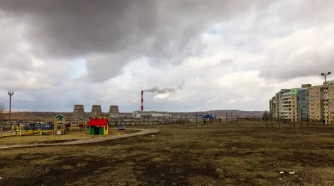 Clouds over park and combined heat and power plant Stock Footage 59193415