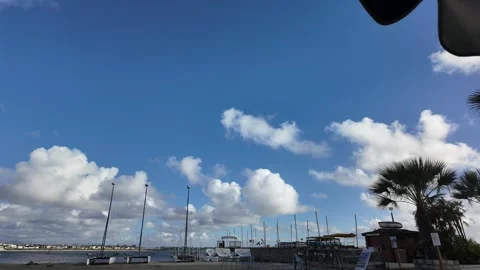 Clouds over pier with boats 스톡 동영상 279050016