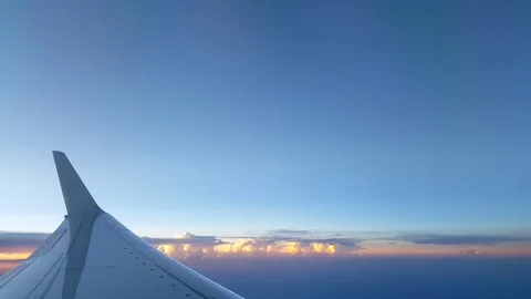 Clouds over plane wing Stock Footage 98421387