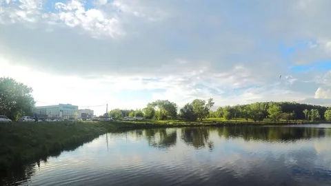 Clouds over pond in summer timelapse Vidéo 77282933