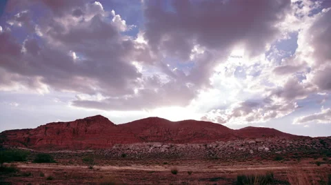 Clouds over red cliffs time lapse Stock Footage 41314667