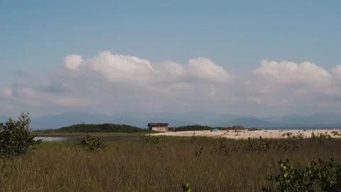 	clouds over the river and lonely house Stock Footage 138067390