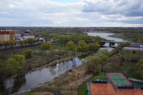Clouds over the river in the city. Stock Photos