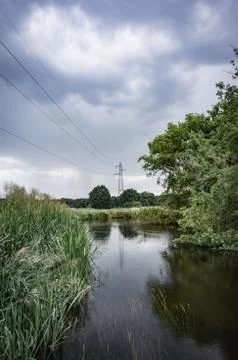 Clouds over the river, the grassy Bank of the river, Stock Photos