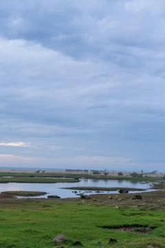 Clouds over the river. pastels colors. Arugam bay, Sri Lanka Stock Photos