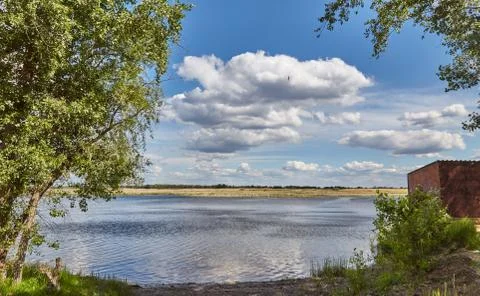 Clouds over the river Stock Photos
