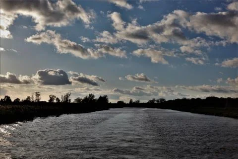 Clouds over a river Foto stock