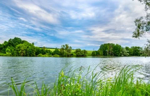 Clouds over river Stock Photos