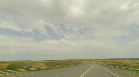 Clouds over the road. The path from Dubovskoe village Stock Footage 56927915