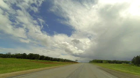 Clouds over the road. The path from Ekaterinovka village - Shutor village, Stock Footage 56694780