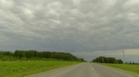 Clouds over the road. The path from Kamyshlov village, Sverdlovsk region Stock Footage 59198174