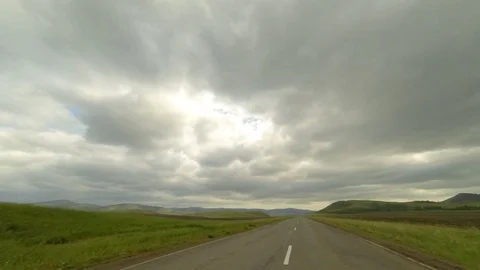 Clouds over the road. The path from Kobyakovo village, Republic of Khakassi.. Stock Footage 75723155