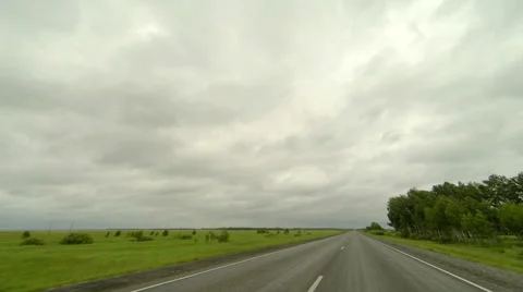 Clouds over the road. The path from Krutinka village, Omsk region, Russia Stock Footage 59517990