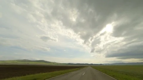 Clouds over the road. The path from Solenoozernoe village, Republic of Khak.. Video stock 75723188