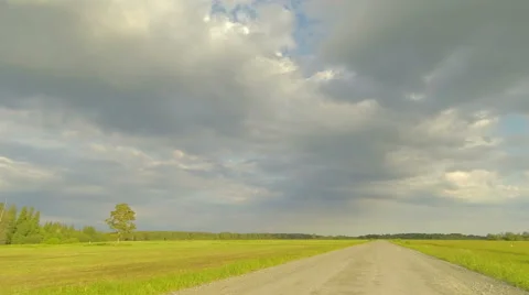 Clouds over the road. The path from Ushakova village, Tyumen region, Russia Stock Footage 59517933