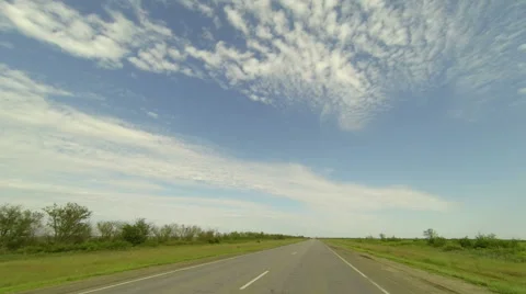 Clouds over the road. The path from Varvarovskoe village Stock Footage 58540072