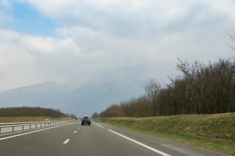 Clouds over the road. Stock Photos
