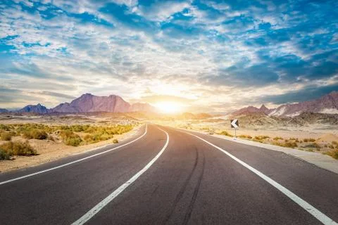 Clouds over road Stock Photos